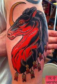 Umsebenzi we-Arm color horse tattoo