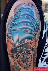 Arm sailboat tattoo work