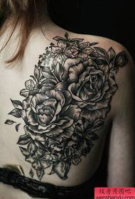 A barra di spettacoli di tatuaggi hà cunsigliatu un mudellu di tatuaggi di fiore di personalità di volta