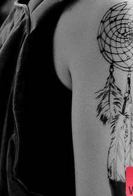 Woman arm dream catcher tattoo work