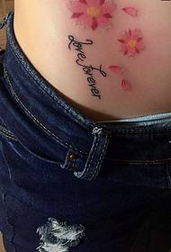 majhna tetovaža češnjevega cveta s tatoo na trebuhu