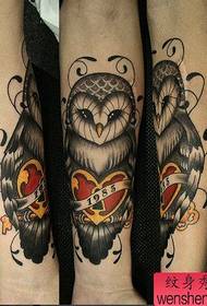 an arm black gray owl Tattoo pattern