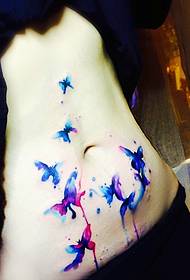 The watercolor tattoo pattern on the girl's abdomen is very beautiful