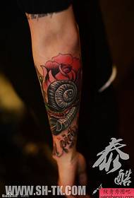 Male arm personality snail rose tattoo pattern