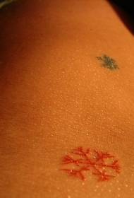 abdomen colored snowflake tattoo pattern