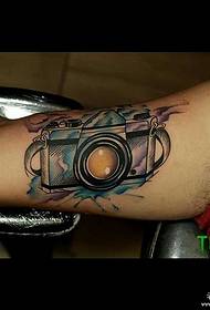 big arm inside splash ink watercolor camera tattoo pattern