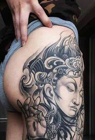 Buddha tattoo tattoo on the outside of the hip