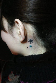 snowflake stars tattoo behind the ear