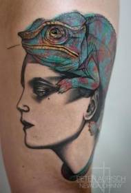 leg unfinished color woman head with large lizard tattoo