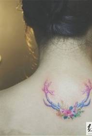 neck small antler tattoo