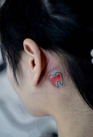 ear behind the creative small Teeth tattoo