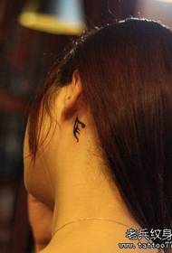Girl's ear small totem tattoo pattern