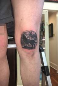 boys on the knees of black gray wolf and round moon tattoo pictures