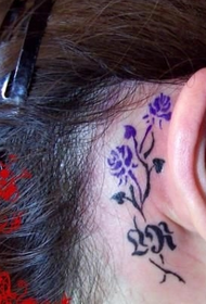 small rose totem tattoo behind the ear