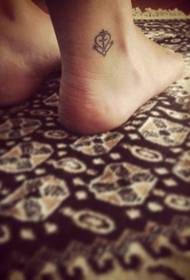 small fresh tattoos on female ankles