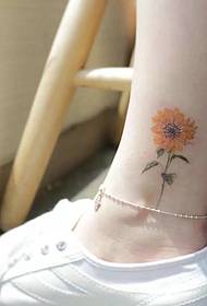 a beautiful sunflower tattoo pattern on the calf