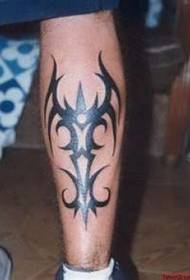 Beautiful totem tattoo on the calf