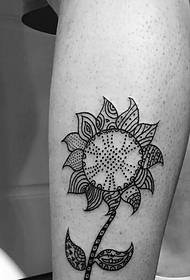black and white sunflower tattoo pattern falling on the leg