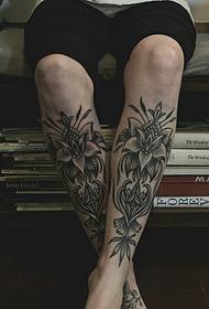 exquisite atmospheric flower tattoo pattern on the outside of the legs