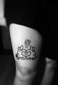 a very creative thigh small totem tattoo tattoo