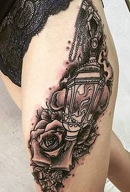 girl's leg outside the eye-catching rose tattoo pattern