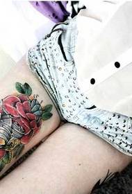 leg camera rose tattoo pattern