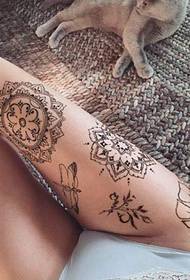 girl sexy thigh on the beautiful decorative style mandala flower tattoo pattern