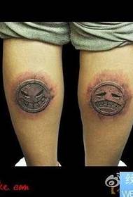 leg stone smile face and crying face expression tattoo pattern