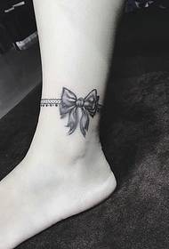 black gray bow tattoo picture on the ankle is very beautiful
