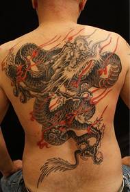 A domineering full back tattoo on the back of a man