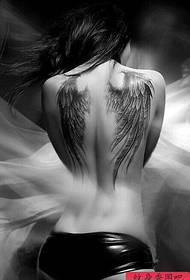 a woman with wings and tattoos