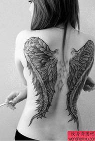 Woman full of wings tattoos