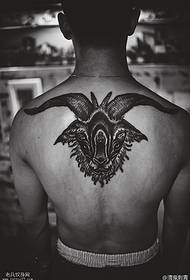 Wzór tatuażu z tyłu cierń, czterooka głowa owcy