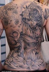 A full-back girl lotus tattoo pattern is provided by a tattoo