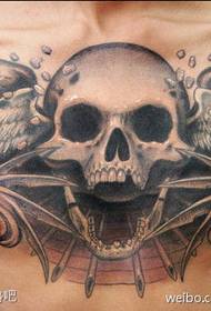 a horrible skull tattoo on the chest