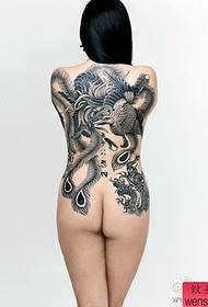 a woman with a black phoenix tattoo pattern