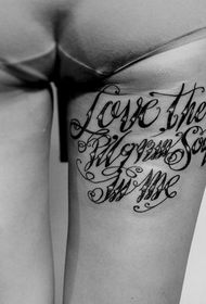 good-looking squirt English tattoo on the thigh