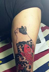 cat and fish stick leg tattoos