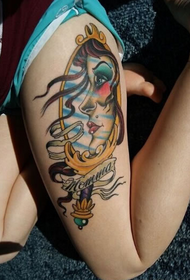mirror pattern color tattoo on the thigh