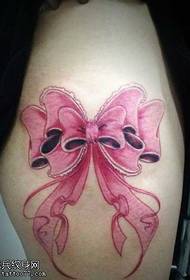 Beautiful bow tattoo pattern on the legs