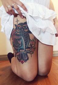 female leg owl tattoo