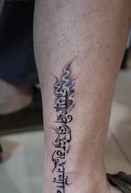 leg fashion Sanskrit tattoo