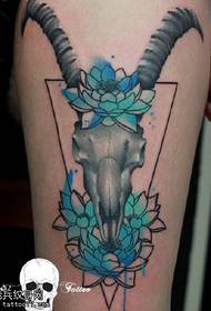 Sheep bone tattoo on the thigh