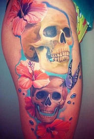 female leg butterfly skull tattoo