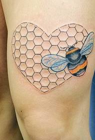 Honeycomb tattoo pattern on the thigh