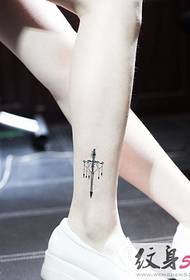 Small tattoo against the legs