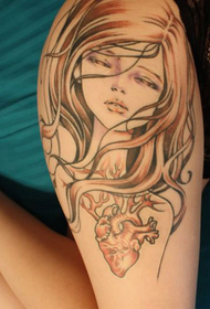 Audrey Kawasaki tattoo on the side of the thigh