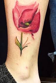 a beautiful flower tattoo picture on the outside of the calf