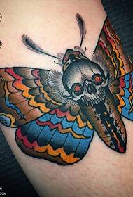 Leg painted moth tattoo pattern