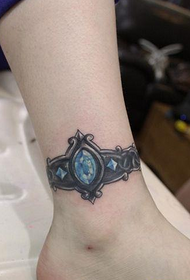 female A jeweled foot ring tattoo pattern on the child's leg